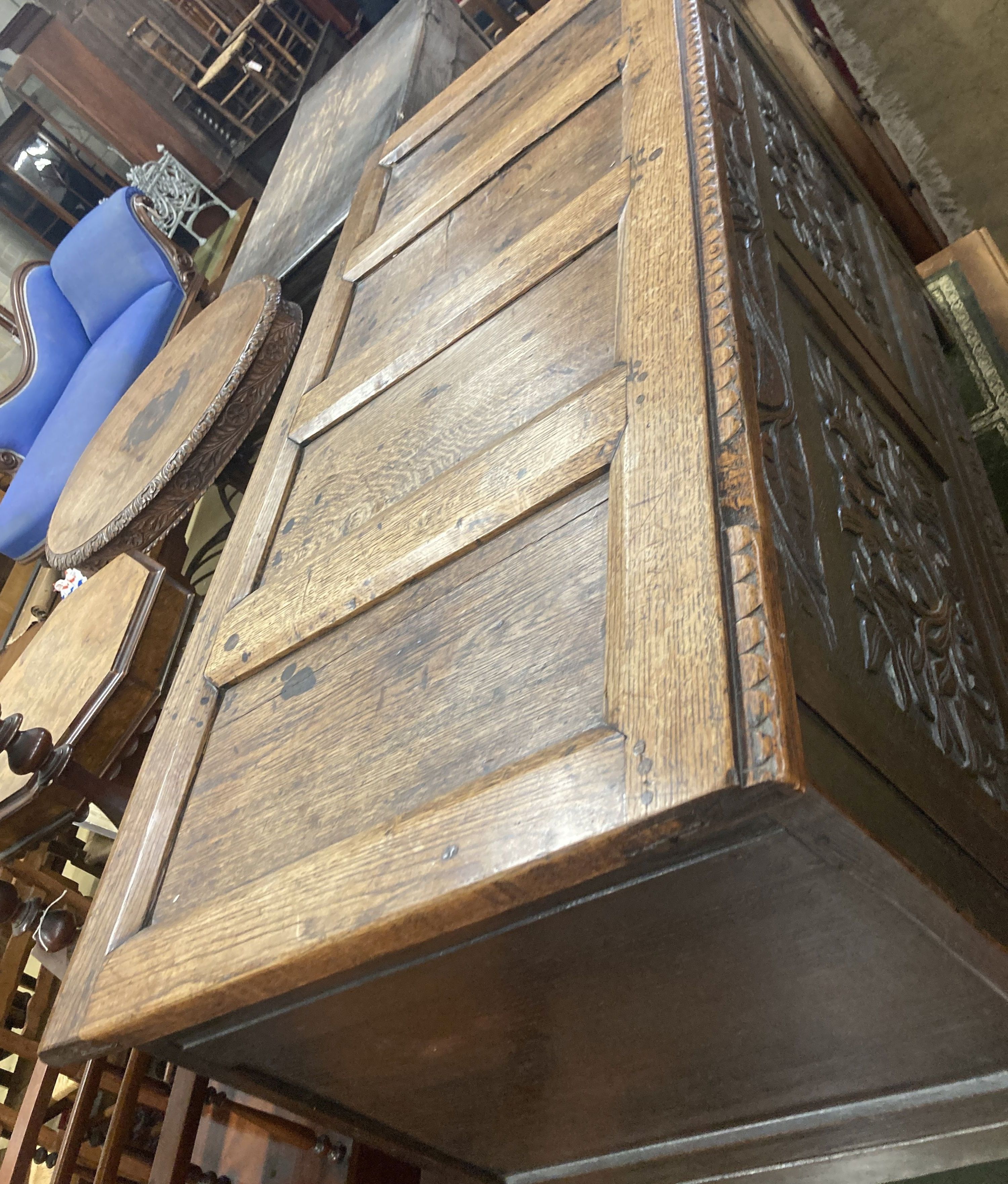 An 18th century carved panelled oak coffer, fitted drawer, length 130cm, depth 58cm, height 75cm